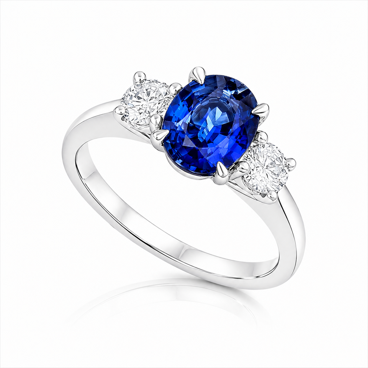 Seraphina 2.25ct oval blue sapphire three-stone ring with 0.60ct round brilliant diamonds in Platinum 950.