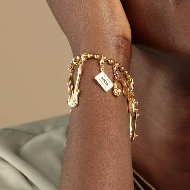 Gold cassette tape charm by Lily Charmed in 18ct gold-plated recycled sterling silver with other charms