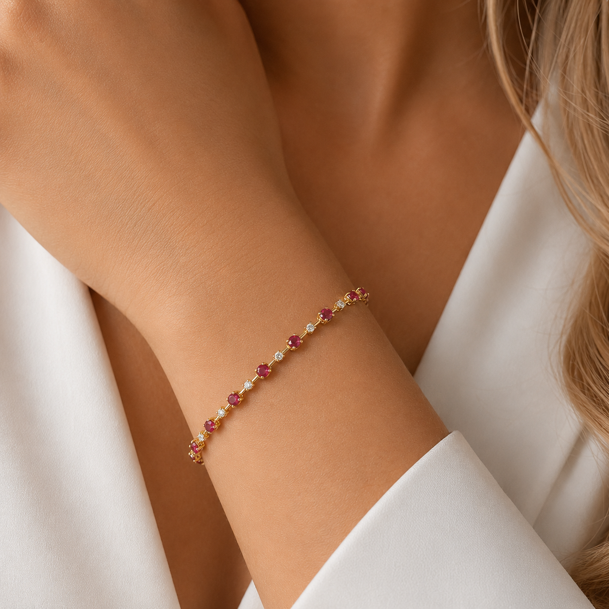 18ct gold ruby and diamond bracelet with alternating natural rubies and brilliant-cut diamond accents.