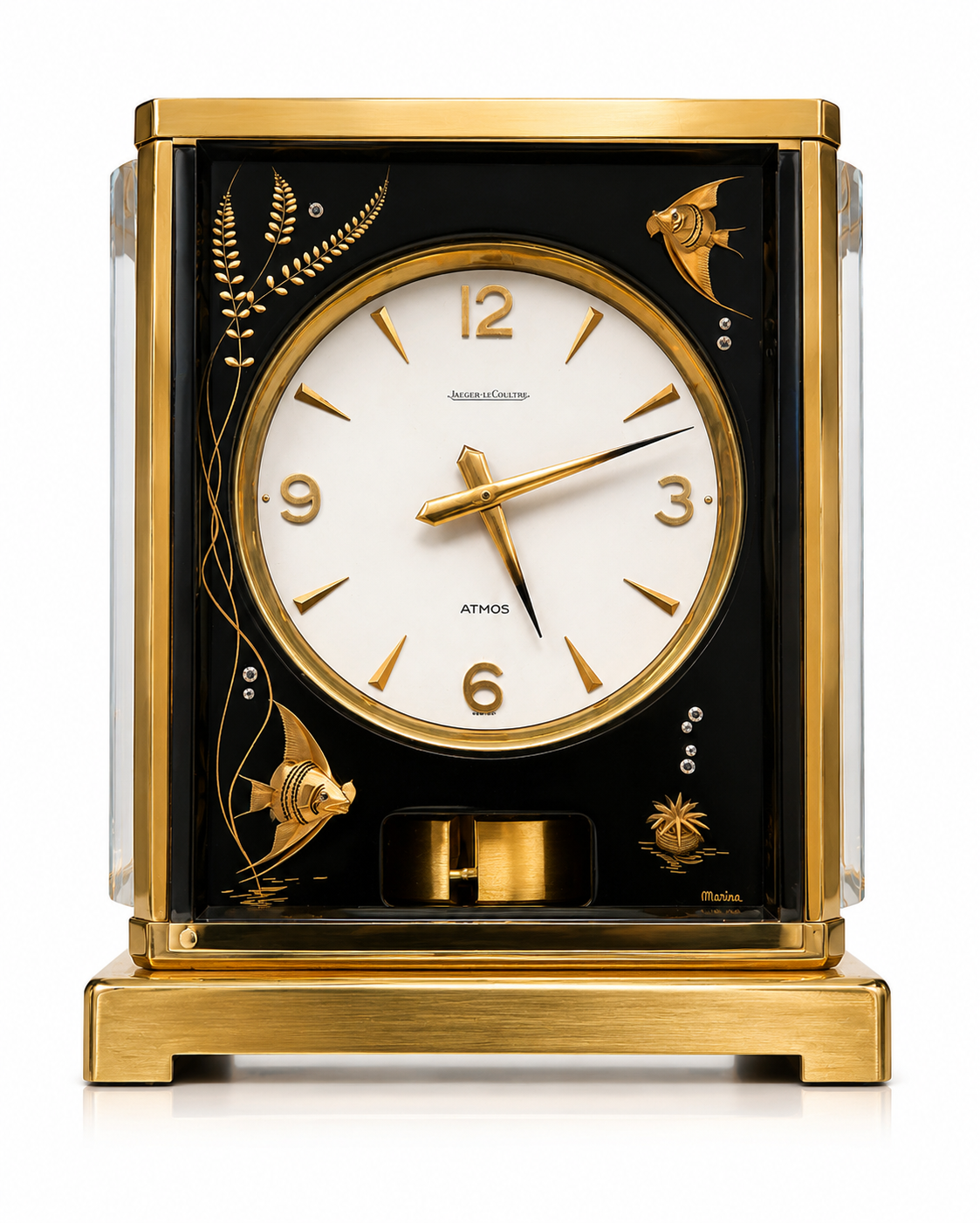 Jaeger-LeCoultre Atmos clock with gold-tone case, black Marina panel, fish and foliage decoration, and white dial.