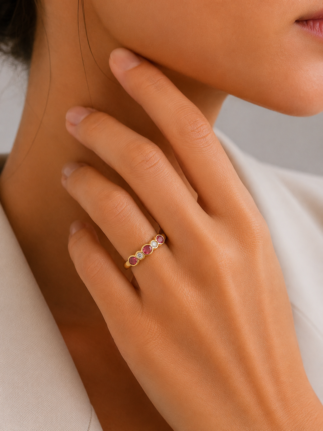 Round pink tourmaline half eternity rubover ring in gold