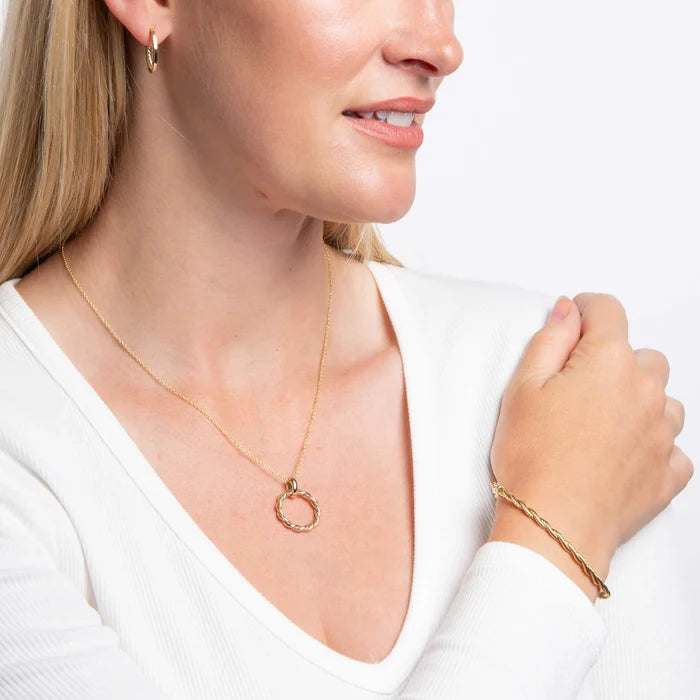 9ct yellow gold rope twist open hoop earrings with polished edges with matching pendant and bangle on the model