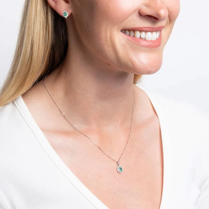 9ct white gold Art Deco emerald and diamond pendant necklace on adjustable chain on the model