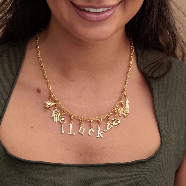 Lily Charmed gold Fatima Hand Hamsa charm in 18ct gold-plated recycled sterling silver on necklace 