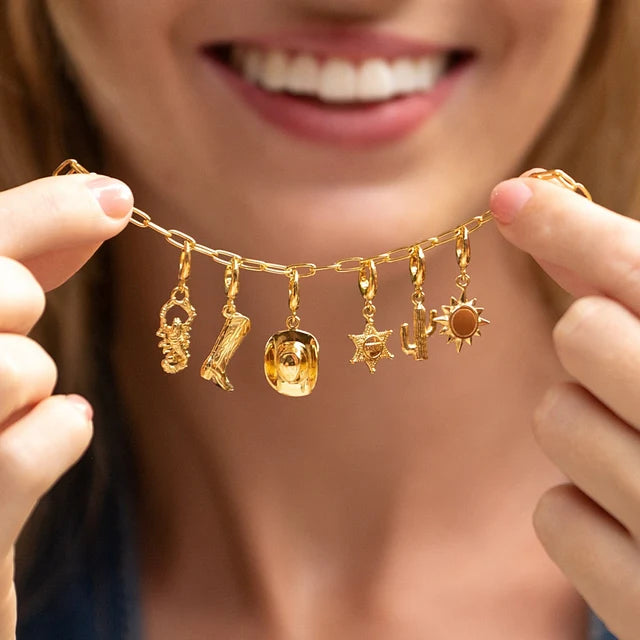 Lily Charmed gold oval link charm bracelet in 18ct gold-plated recycled sterling silver with charms