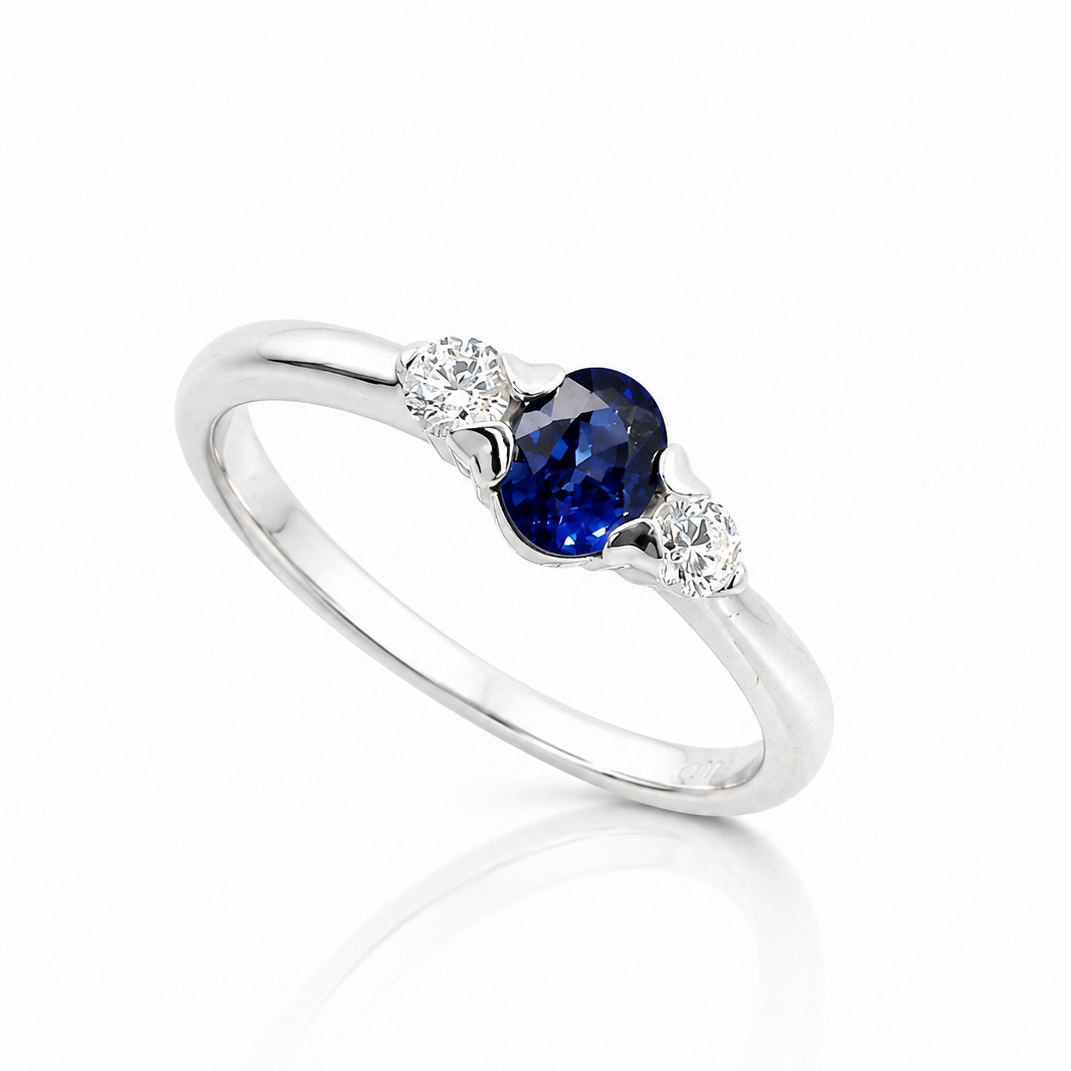 The Azure 18ct white gold ring with vivid oval blue sapphire and two round brilliant-cut diamonds
