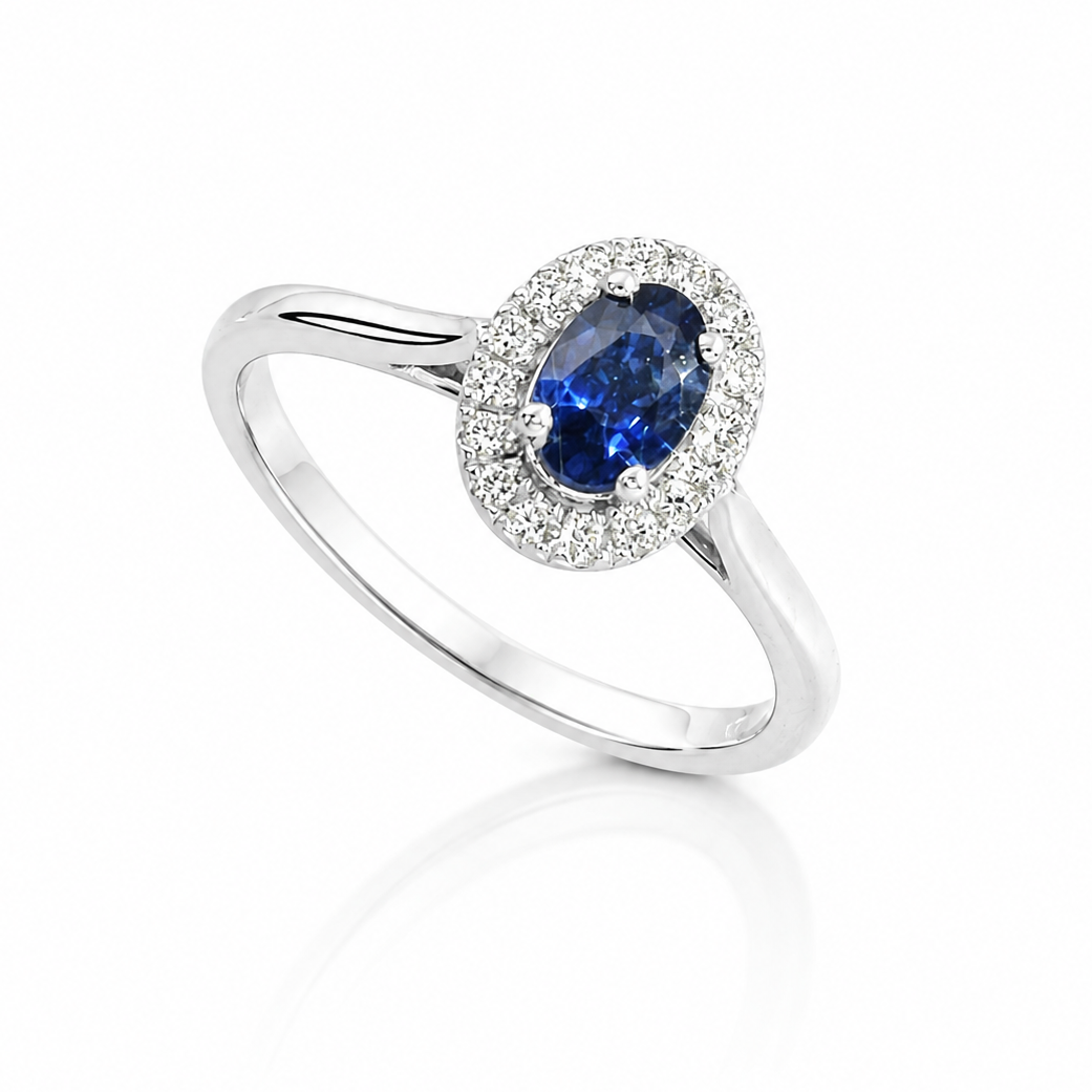 The Celeste 18ct white gold ring with 0.50ct oval blue sapphire and 0.11ct brilliant-cut diamond halo