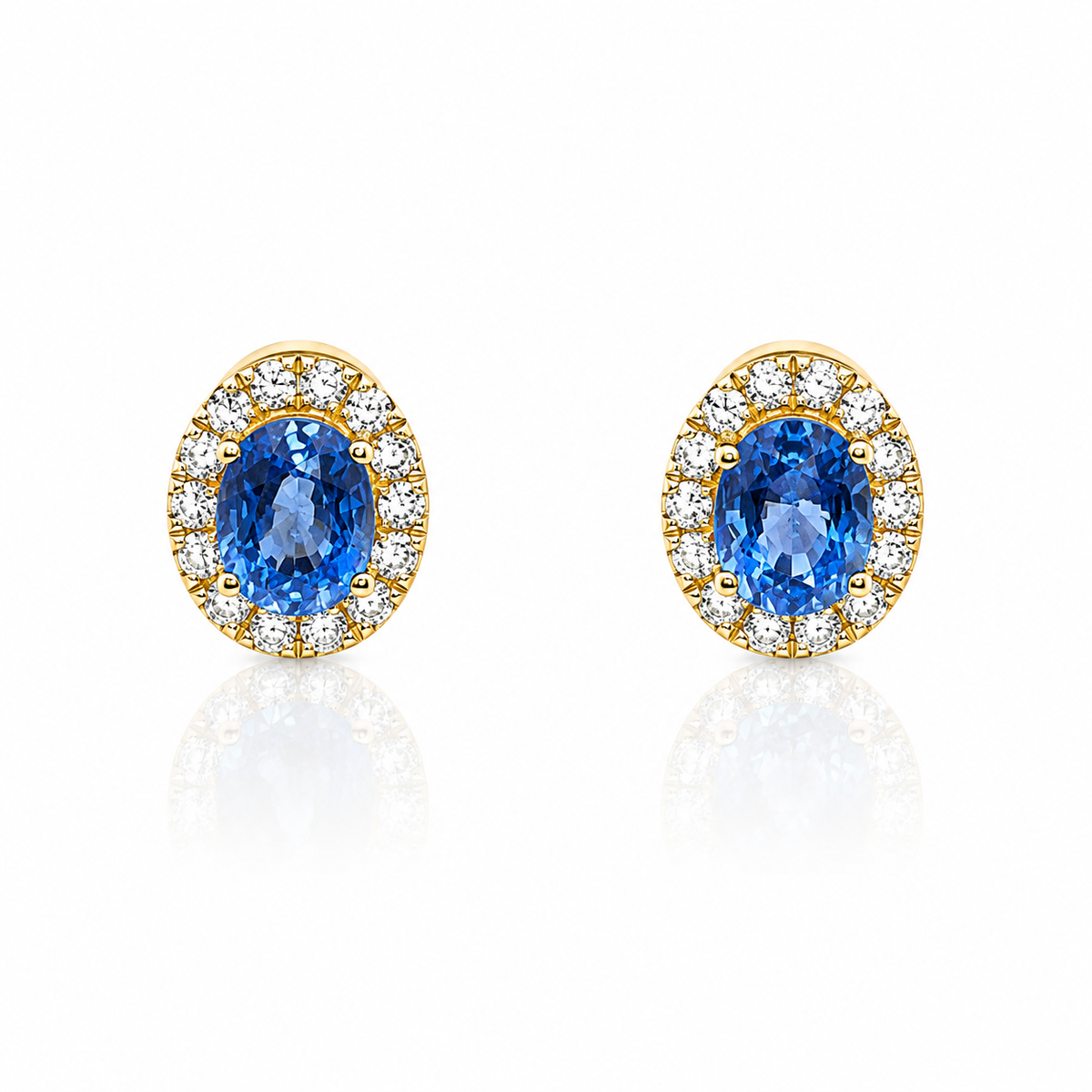 Lyra oval cornflower-blue sapphire and diamond halo earrings in 18ct yellow gold by Marcus Tempus