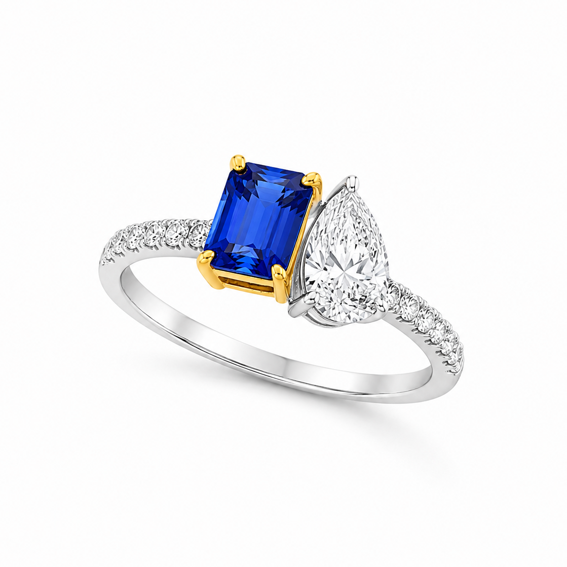Celestine platinum ring with emerald-cut blue sapphire, 0.70ct pear-cut diamond and diamond-set shoulders.