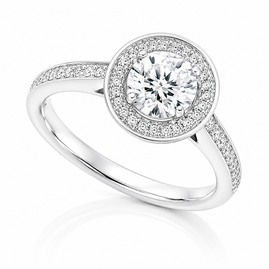 The Alessia 18ct white gold engagement ring with IGI-certified 0.30ct F SI1 natural round brilliant diamond, halo and diamond-set shoulders.