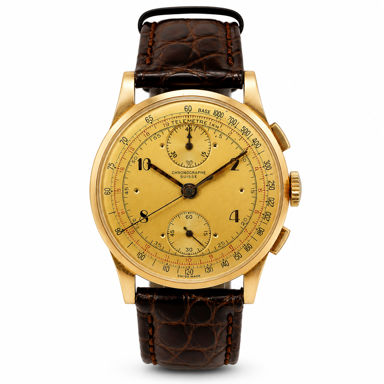Vintage Swiss chronograph watch in 18ct yellow gold with golden dial, telemeter scale and brown leather strap.
