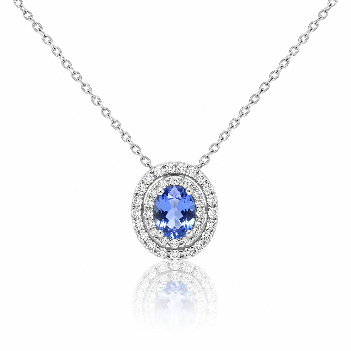 Oval tanzanite and diamond double halo pendant in white gold