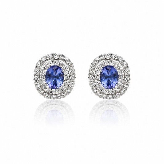 Oval tanzanite and diamond double halo stud earrings in white gold