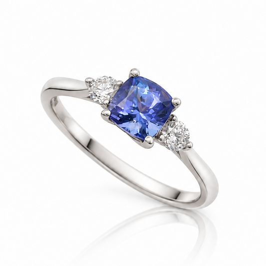 9ct white gold cushion-cut tanzanite three-stone ring with two brilliant diamonds