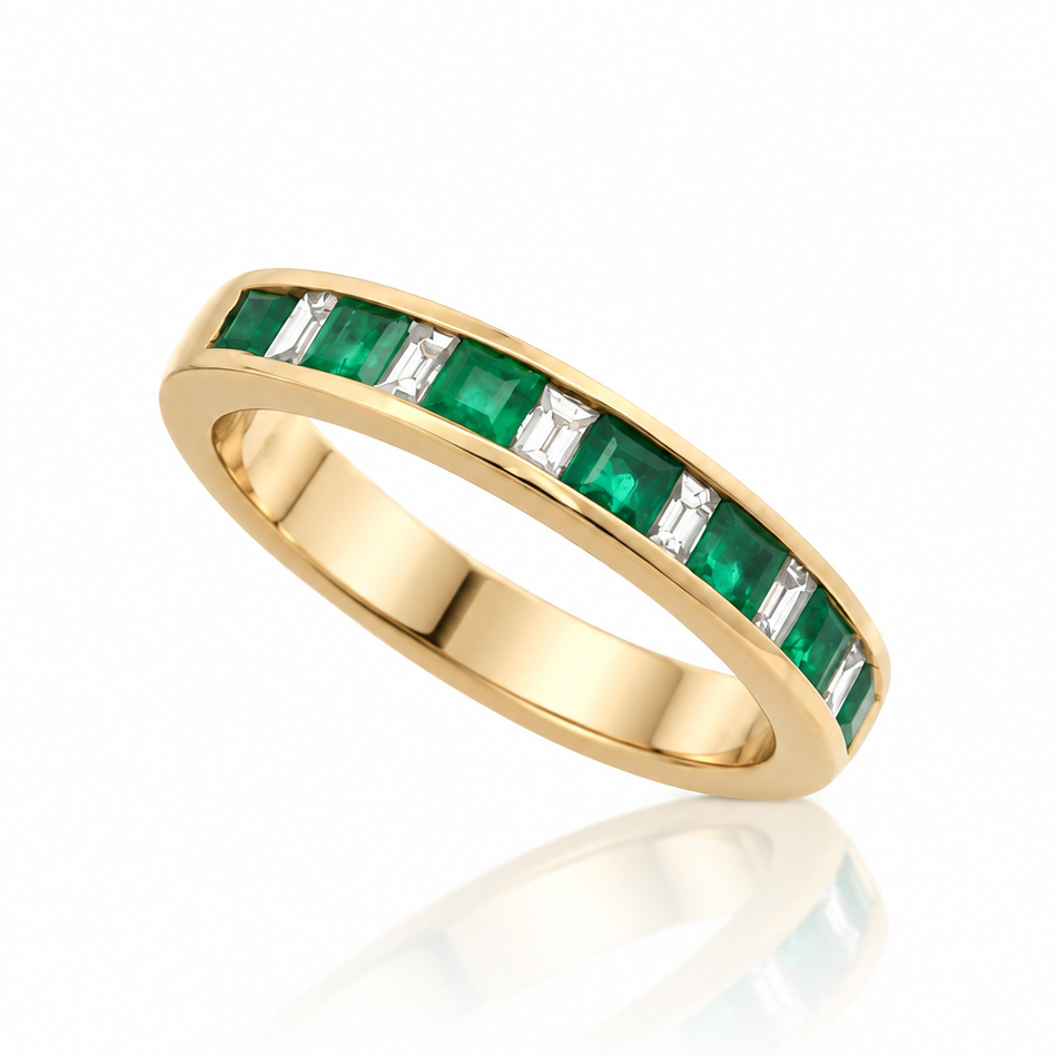 9ct yellow gold channel-set ring with alternating emeralds and baguette diamonds
