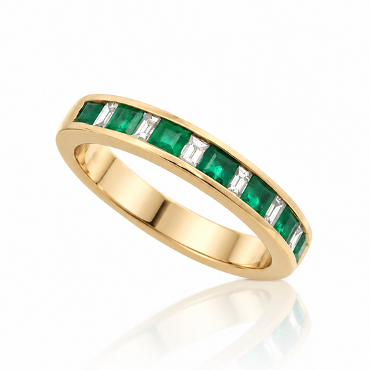 9ct yellow gold channel-set ring with alternating emeralds and baguette diamonds