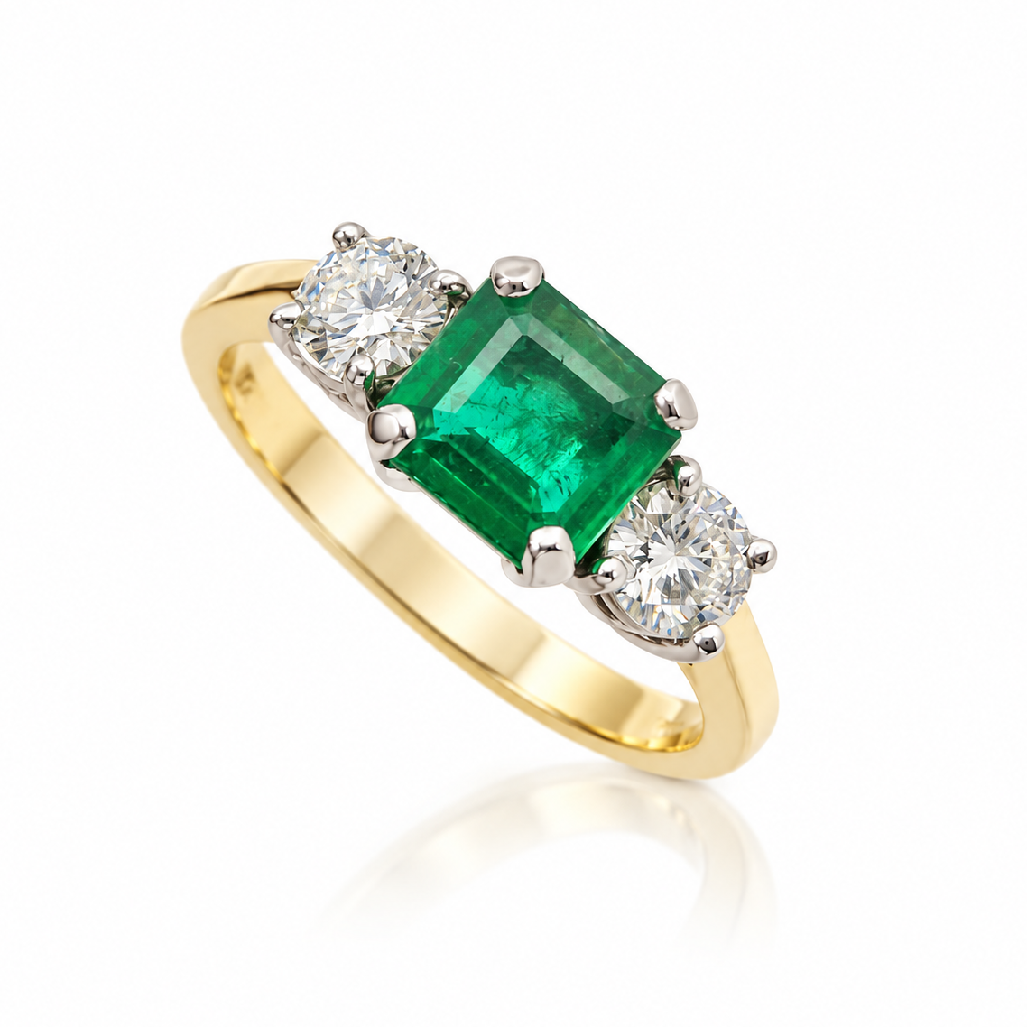 18ct yellow gold emerald-cut emerald and diamond three-stone ring