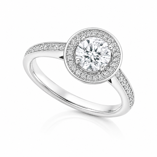 The Alessia 18ct white gold engagement ring with IGI-certified 0.30ct F SI1 natural round brilliant diamond, halo and diamond-set shoulders.