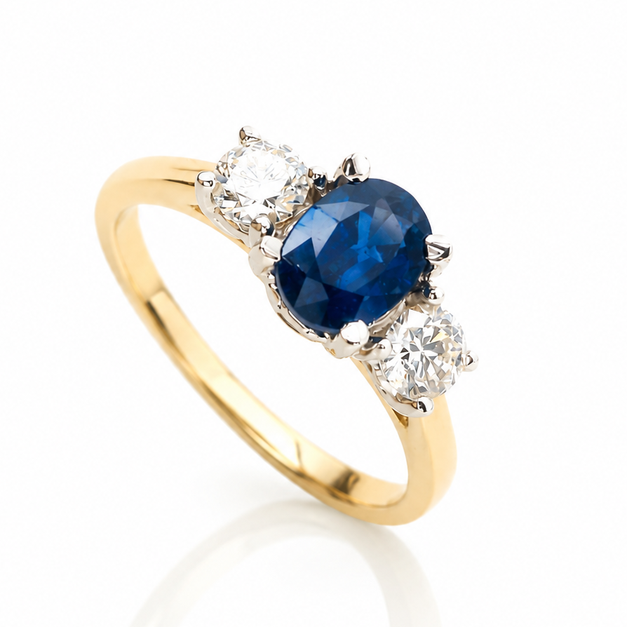 18ct yellow gold trilogy ring with 1.06ct oval natural blue sapphire and two round brilliant diamonds totalling 0.42ct