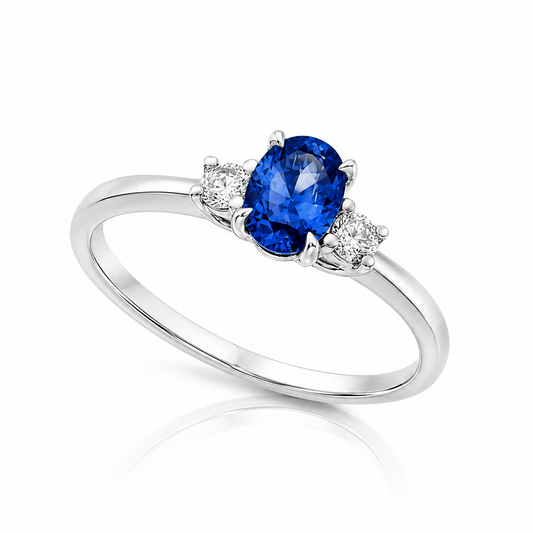 Elara oval blue sapphire and diamond trilogy ring in 18ct yellow gold and platinum by Marcus Tempus.