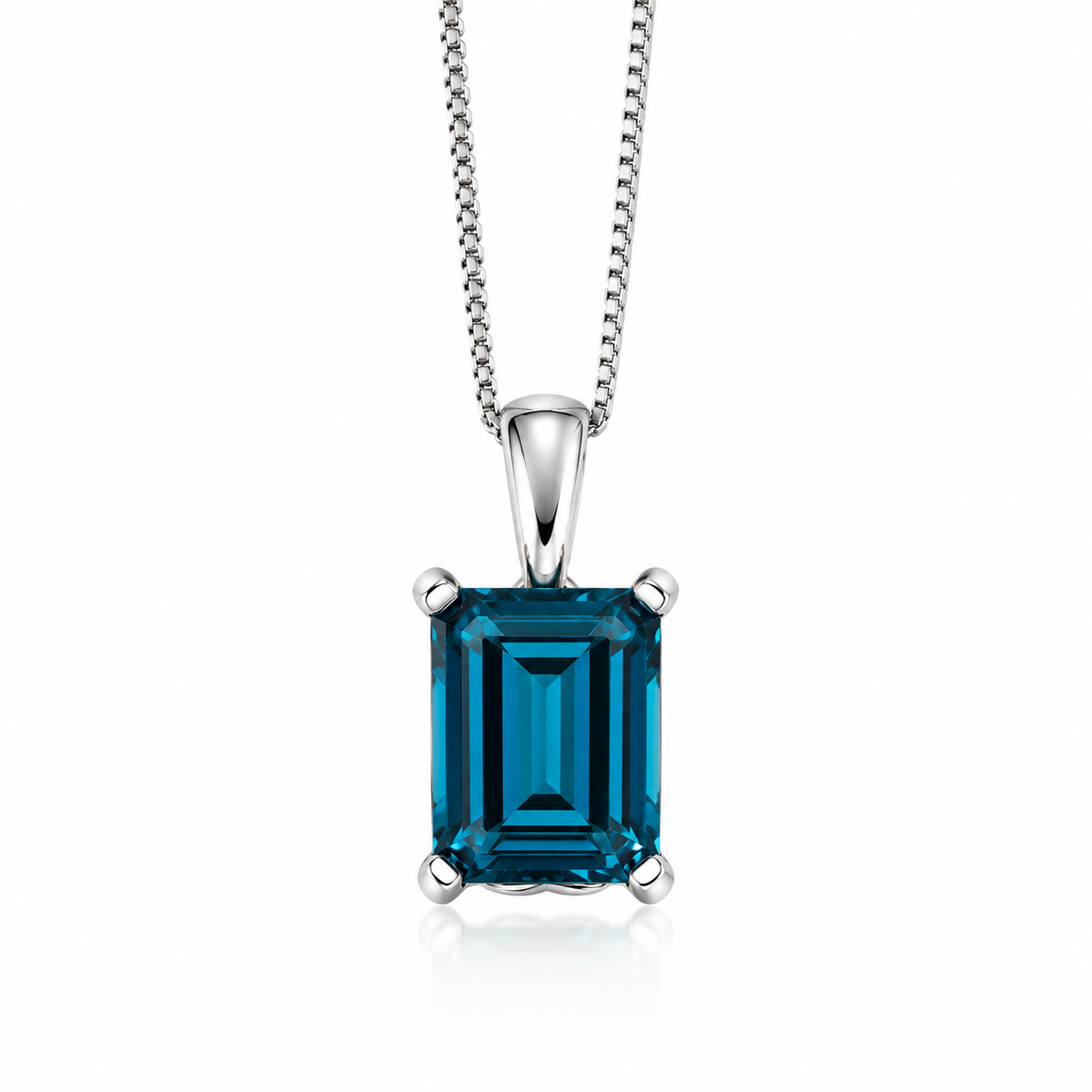 Natural rectangular blue topaz pendant in 9ct white gold with an adjustable fine curb chain.