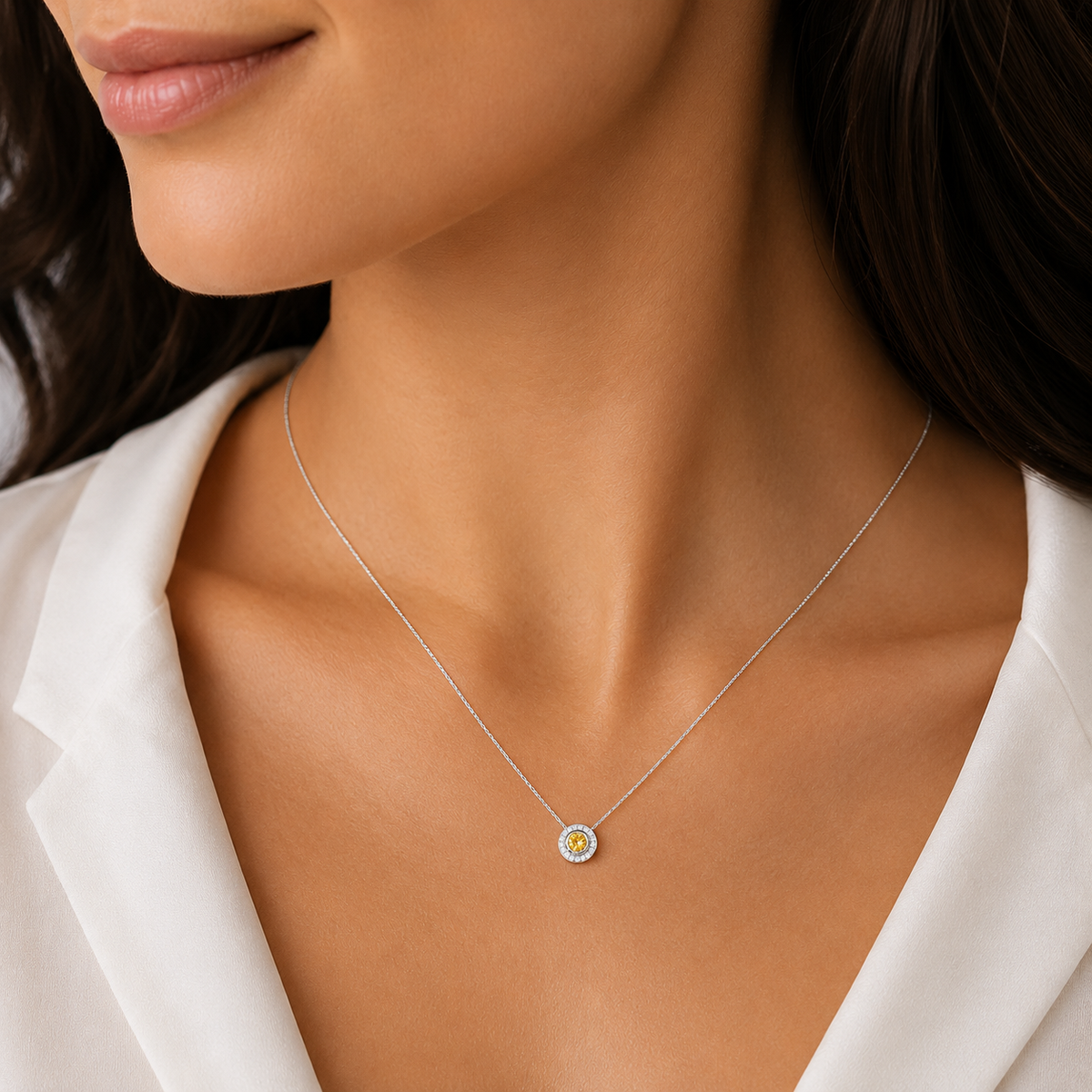 Natural fancy yellow diamond halo pendant with a golden yellow centre diamond surrounded by sparkling white diamonds.