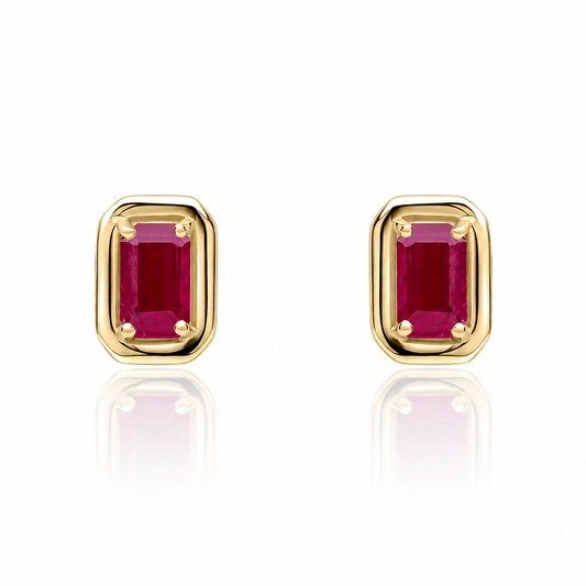 Natural ruby stud earrings worn on ear in 9ct yellow gold