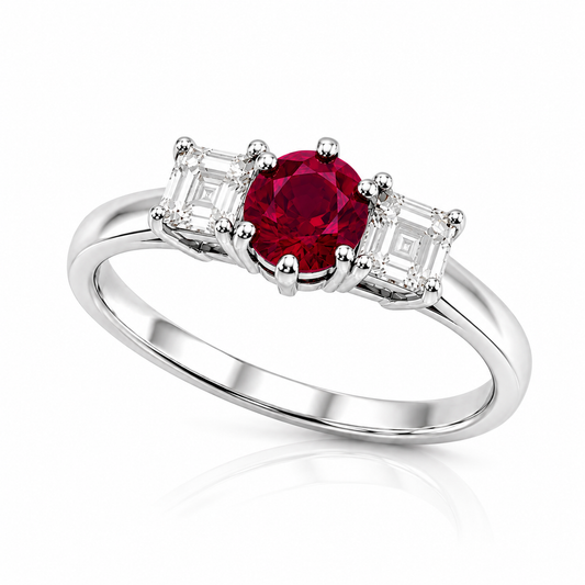 Vintage platinum three stone ring with a 0.33ct natural ruby and two emerald-cut diamonds.