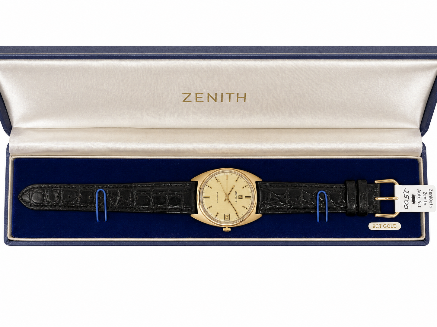 Vintage Zenith Automatic watch with gold-tone case, champagne dial, date display and black leather strap.