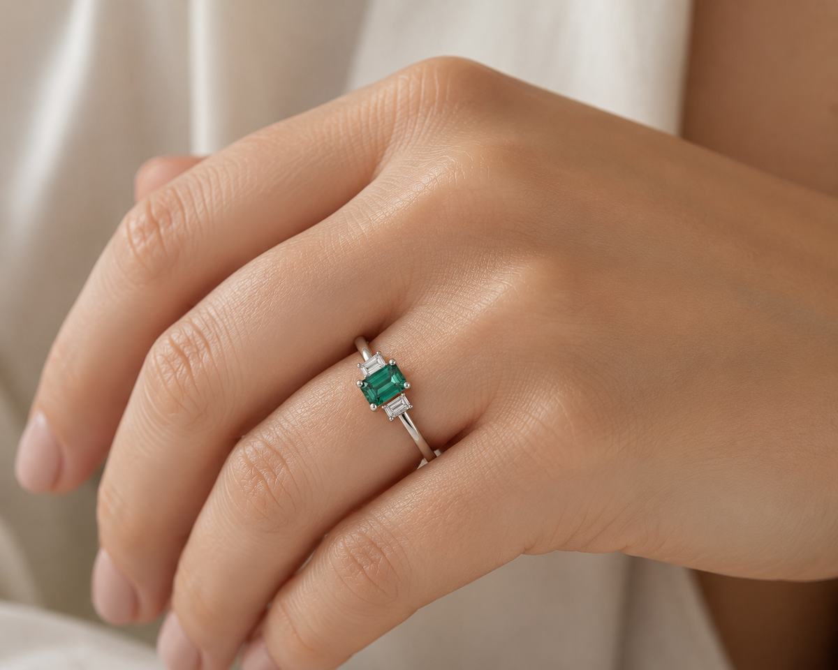 Green tourmaline and diamond three-stone ring in white precious metal