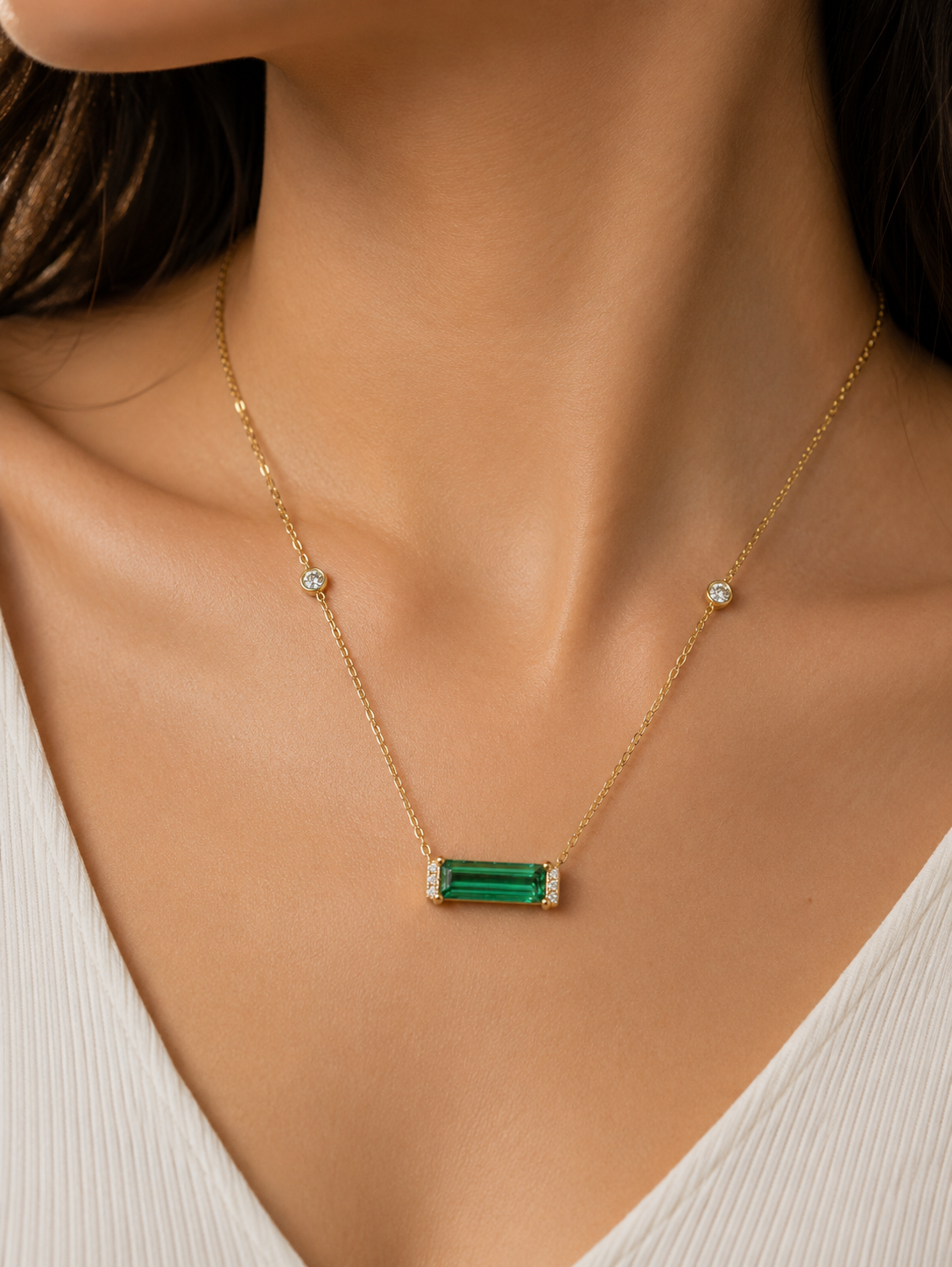 Elongated octagonal green tourmaline pendant with diamond accents
