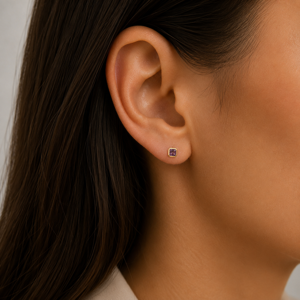 9ct yellow gold octagon-cut amethyst stud earrings with contemporary rubover settings