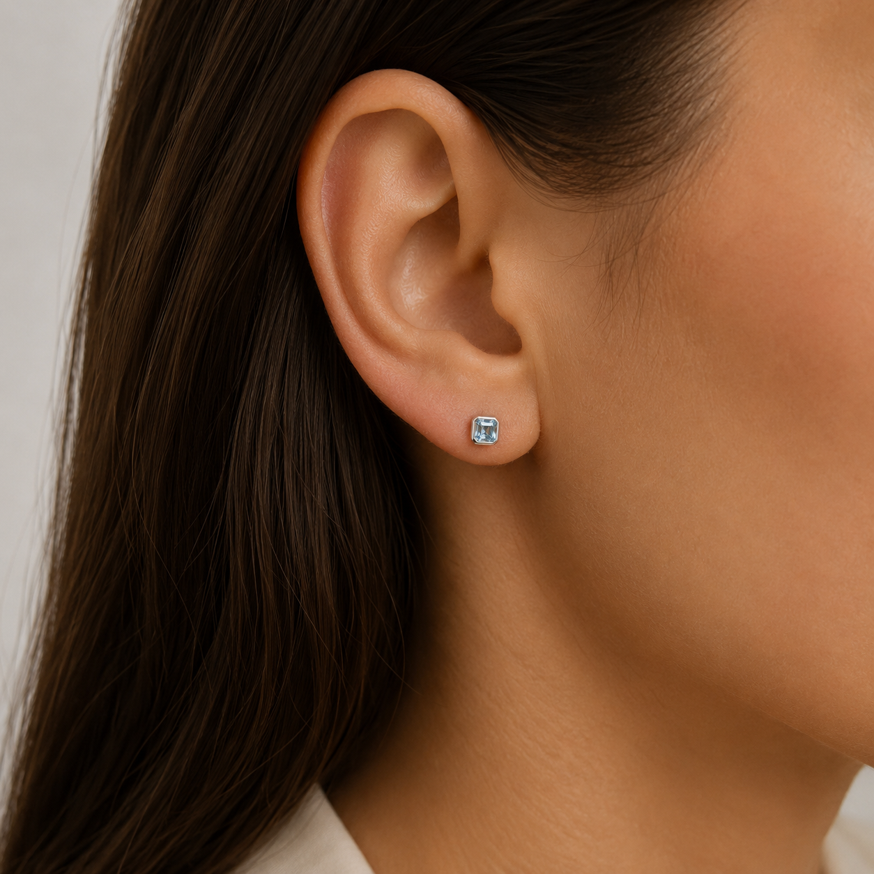 9ct yellow gold octagon-cut aquamarine stud earrings with contemporary rubover settings
