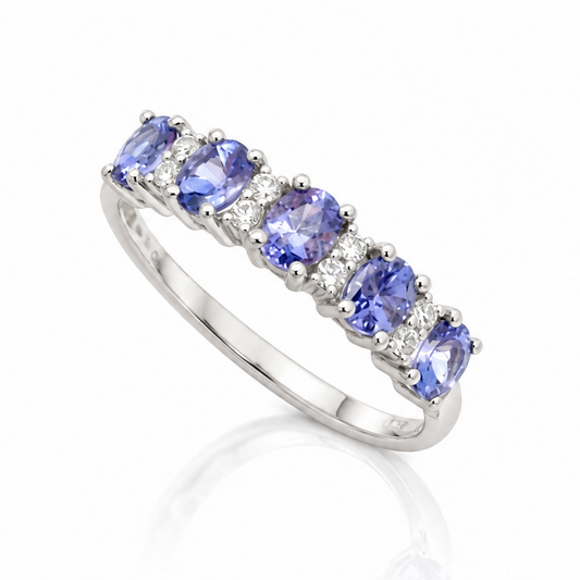 9ct white gold ring set with five oval tanzanites and diamond accents