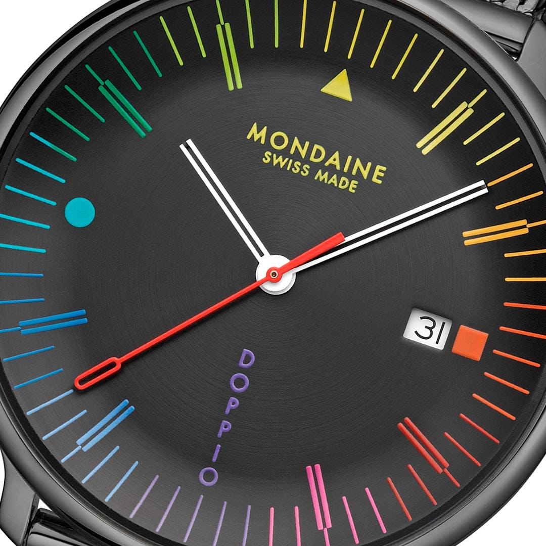 Close up on Mondaine Doppio 41mm black Swiss watch with colourful Bauhaus dial and Milanese mesh bracelet