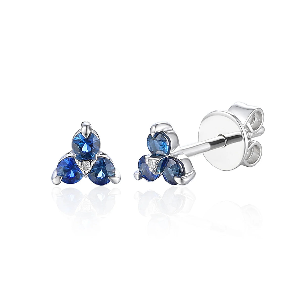 Fleur blue sapphire and diamond three-stone trefoil stud earrings in gold.