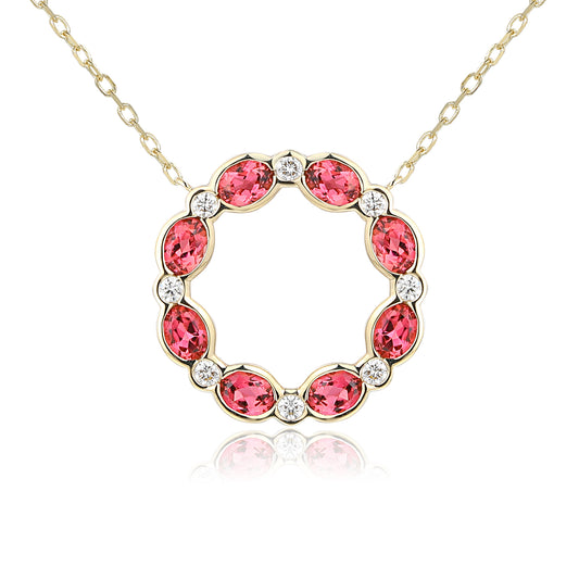 Oval pink tourmaline and diamond circle necklace in gold with natural pink gemstone and diamond surround.