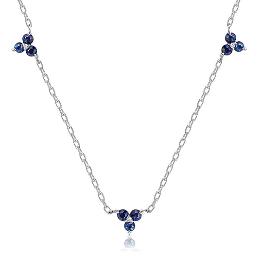 Fleur blue sapphire and diamond trefoil necklace with three floral gemstone clusters.
