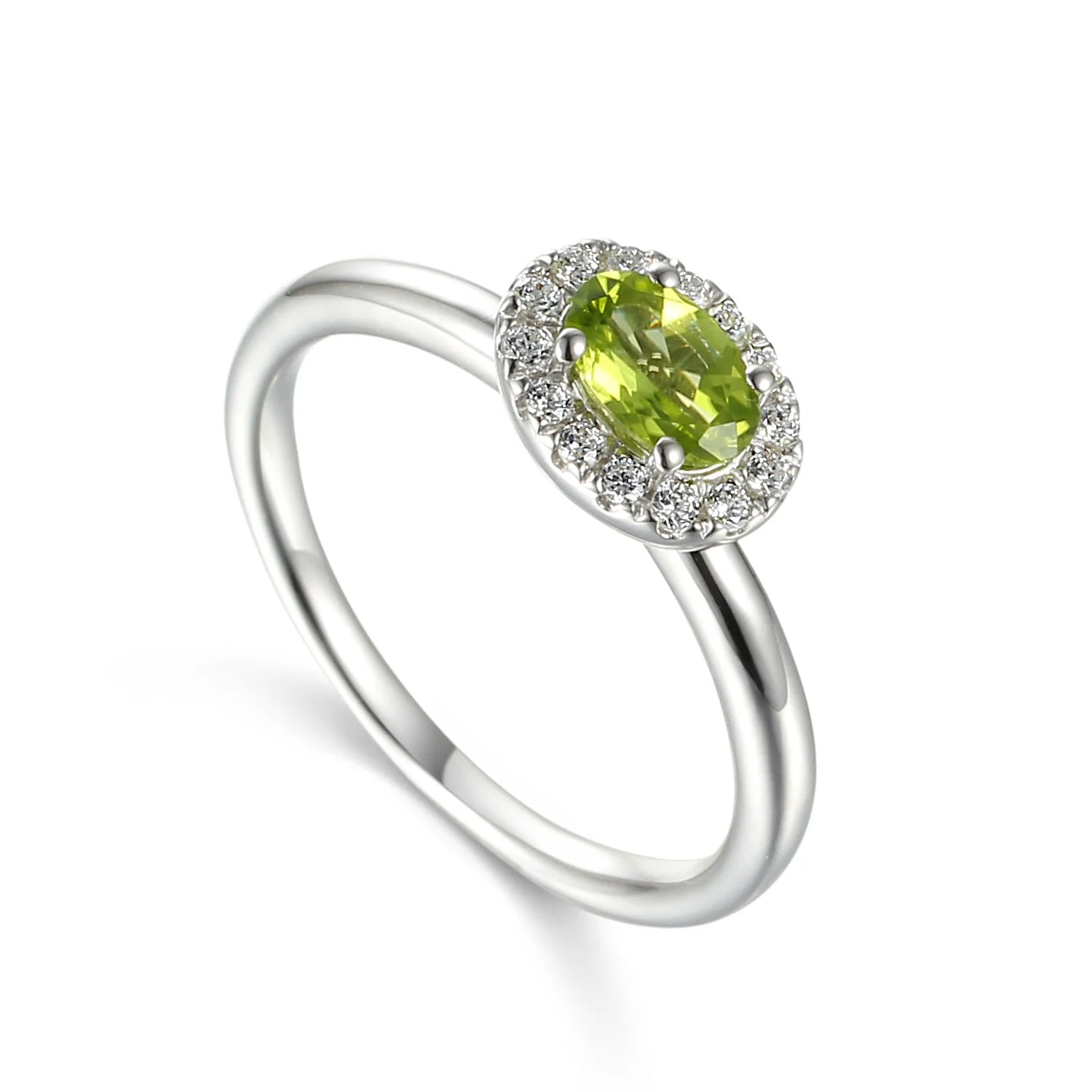 9ct white gold ring featuring a 5 × 4mm oval cut natural peridot surrounded by a sparkling diamond cluster
