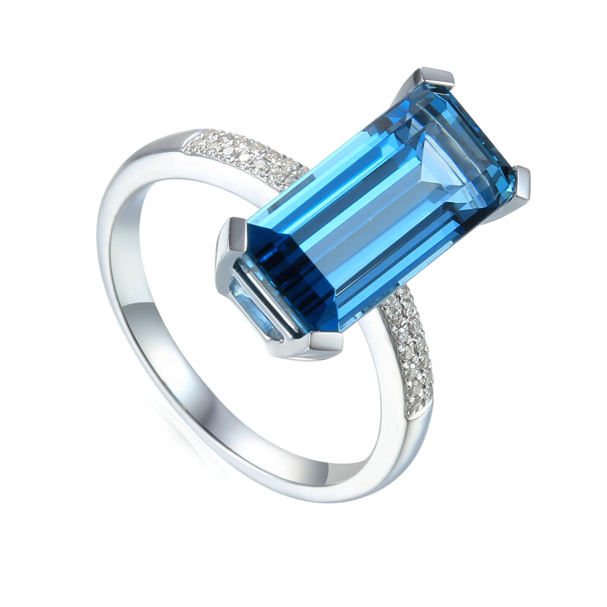 Discover a 9ct white gold London Blue Topaz ring with a 15 × 7mm long octagonal centre stone and 0.07ct pavé diamond shoulders.