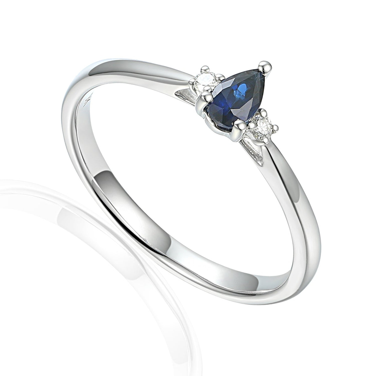 Isolde white gold ring with pear-cut blue sapphire and two round brilliant-cut diamond side stones.