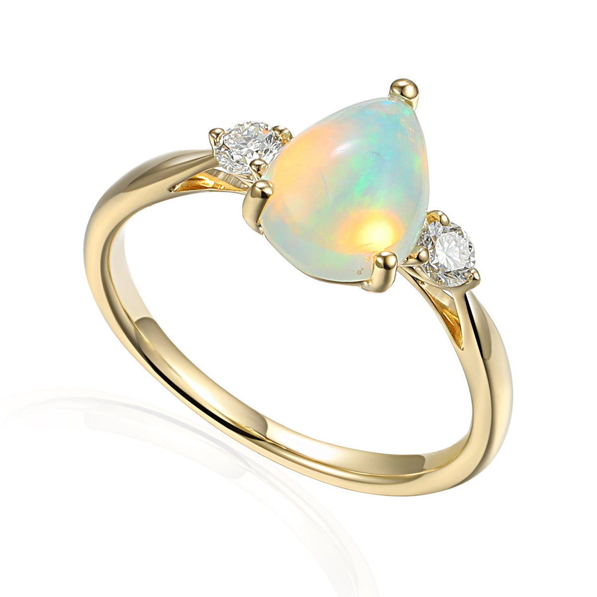 Pear opal and diamond three stone ring in gold