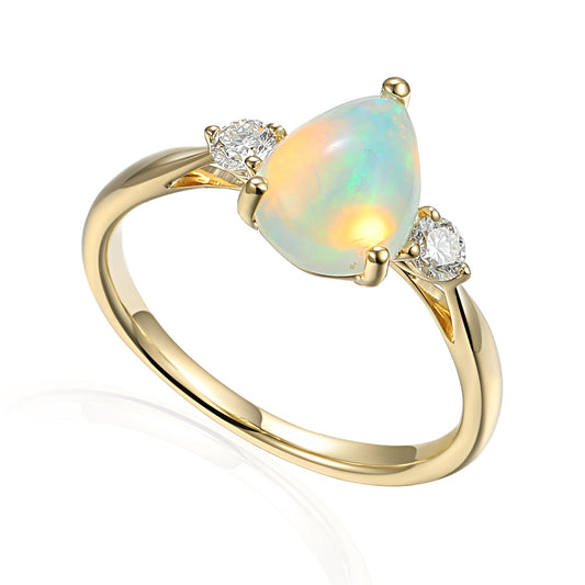 Pear opal and diamond three stone ring in gold