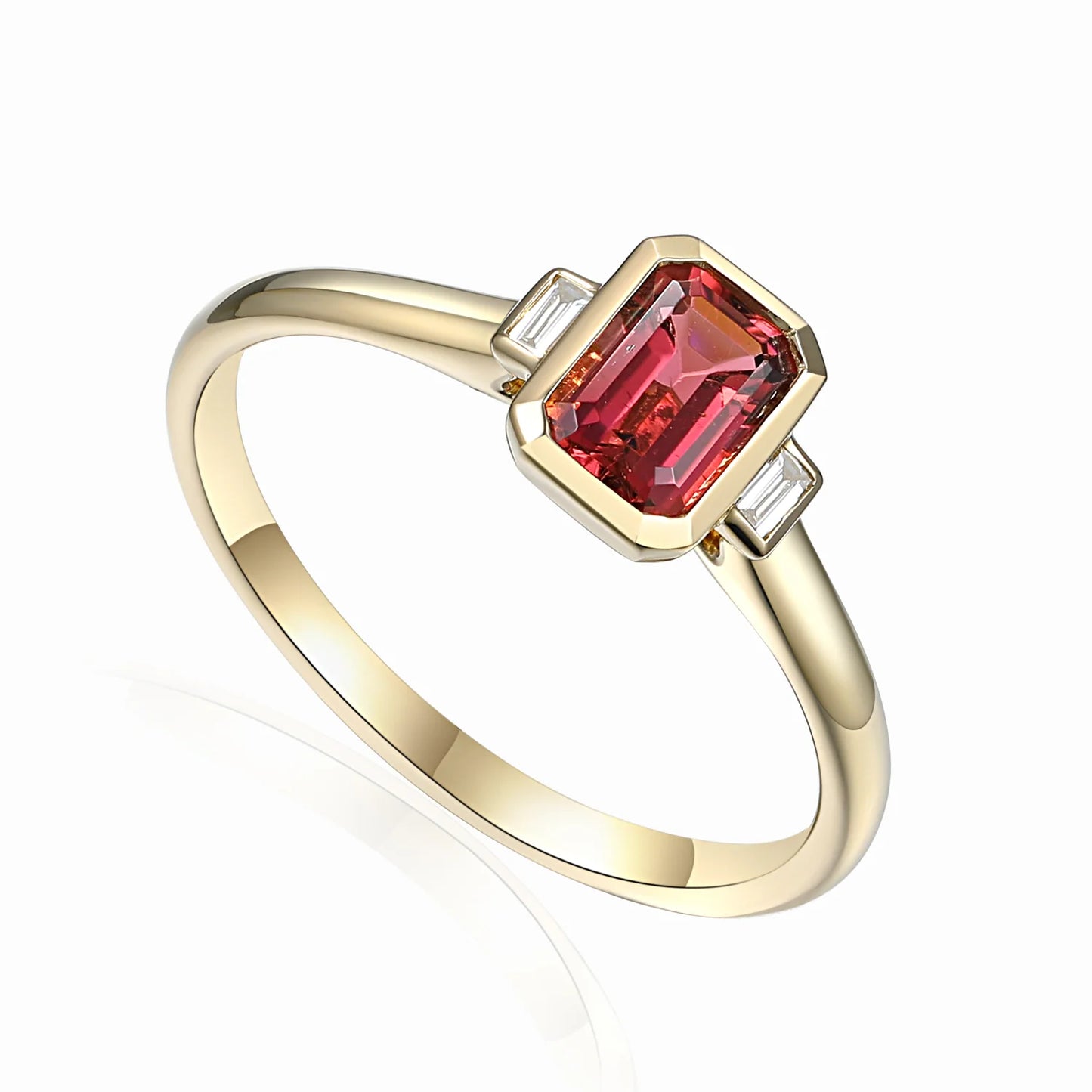 Pink tourmaline octagon ring with emerald-cut diamonds in gold rubover settings