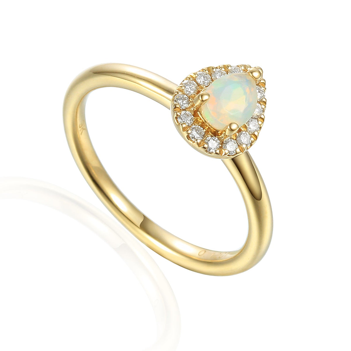 Pear-shaped Opal and diamond cluster ring in yellow gold