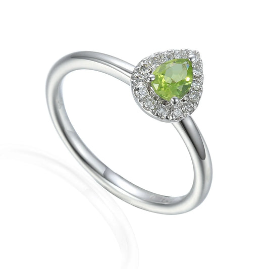 18ct white gold ring featuring a natural pear cut peridot surrounded by a sparkling natural diamond cluster