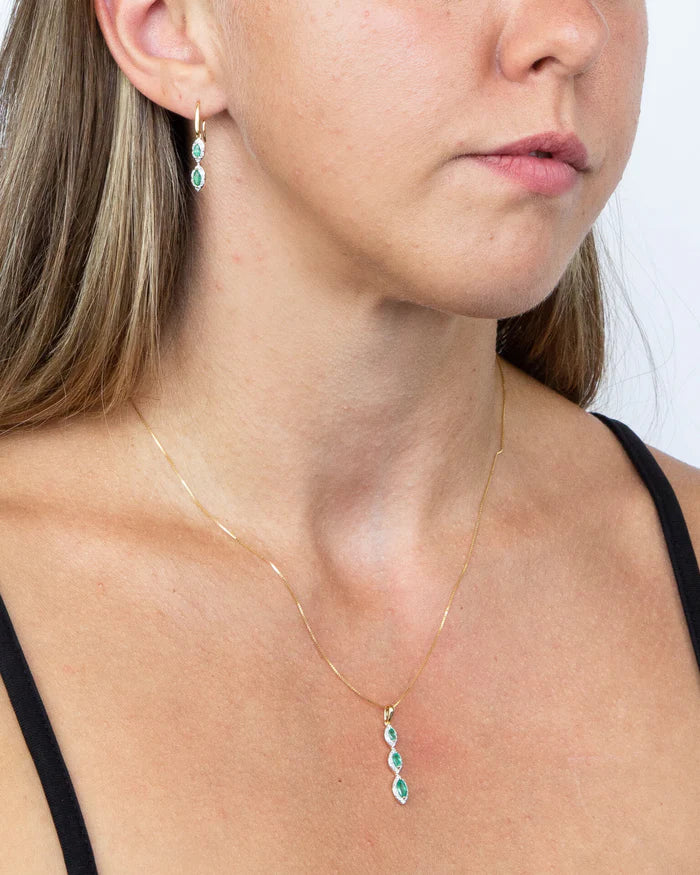 Marquise ruby pendant with diamond halos in 9ct yellow gold
