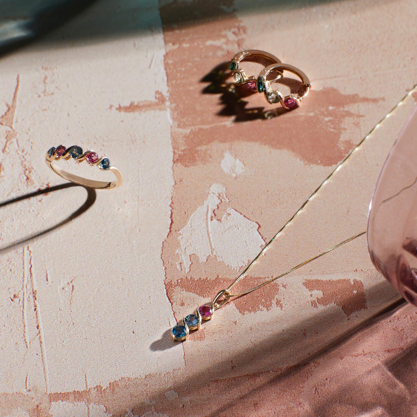 9ct yellow gold Amalfi pendant with natural green sapphire, pink tourmaline and London blue topaz. Includes an adjustable 16–18 inch chain.