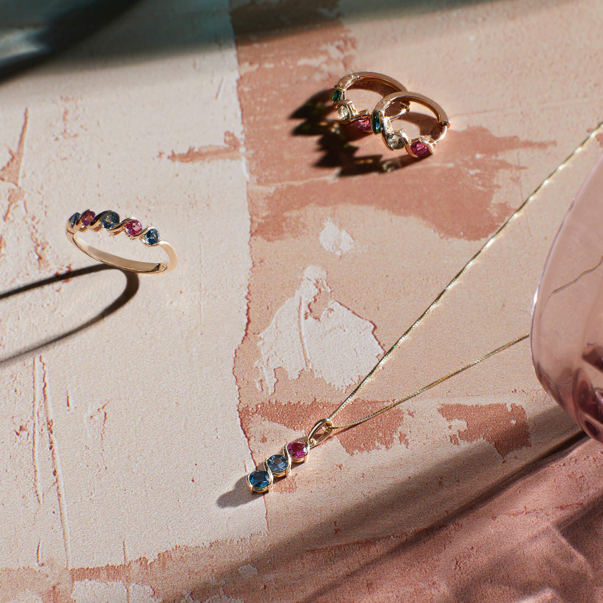 9ct yellow gold Amalfi pendant with natural green sapphire, pink tourmaline and London blue topaz. Includes an adjustable 16–18 inch chain.