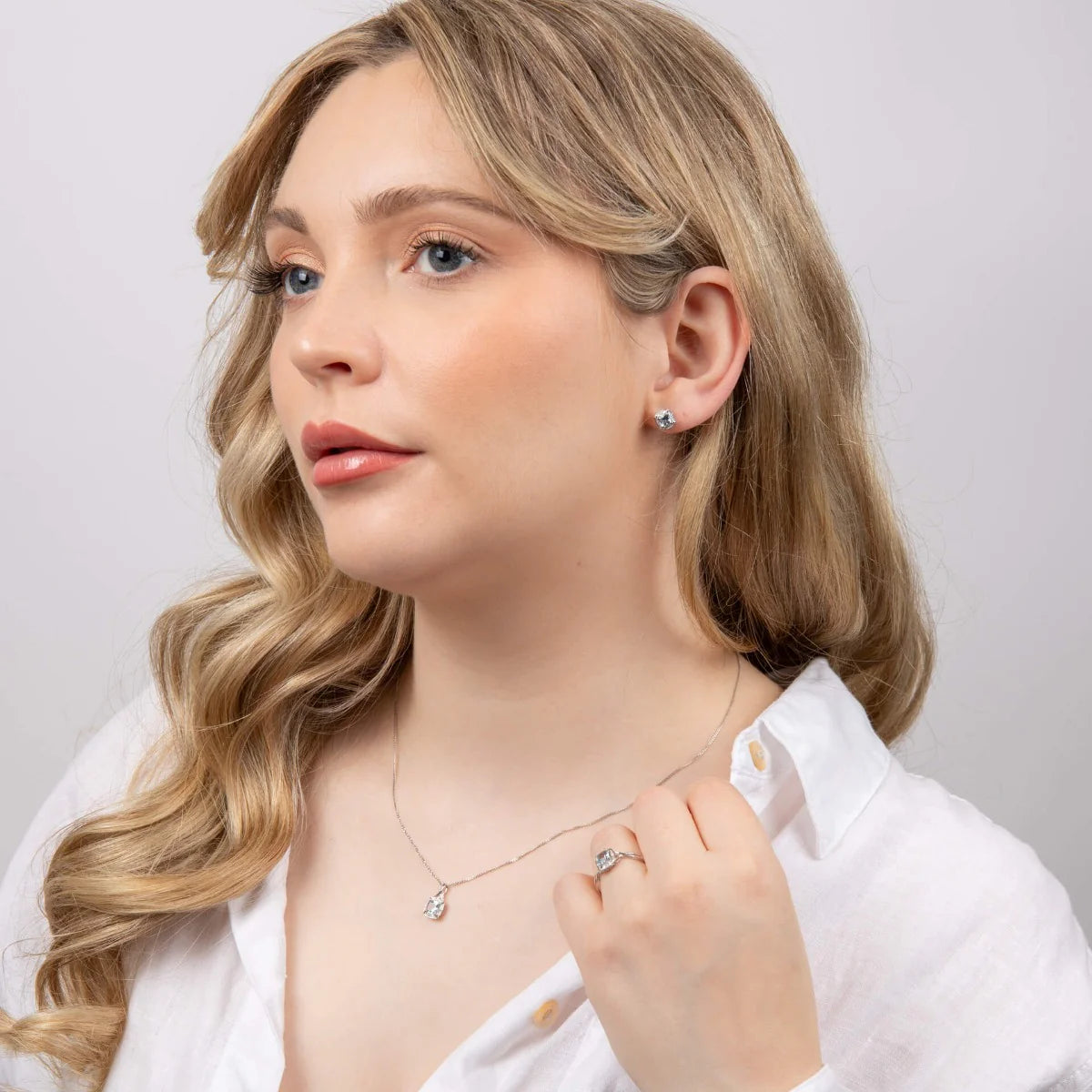Aquamarine Twist Pendant with Diamond Surround in 9ct Gold